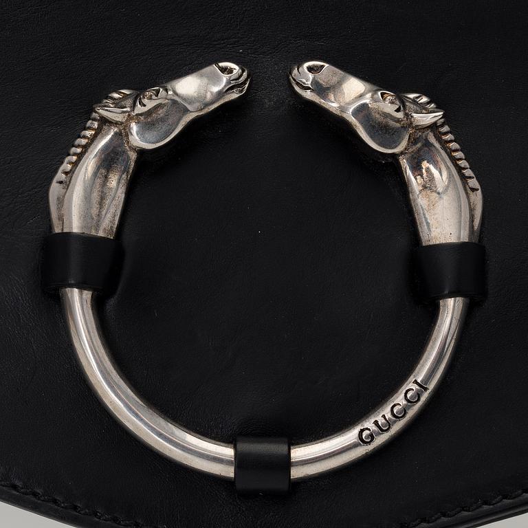 A LEATHER RIBOT HORSE HEAD CLUTCH.