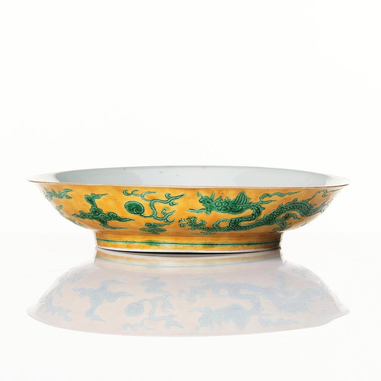 A yellow and green glazed anhua decorated five clawed dragon dish,  Qing dynasty with Jiajing mark.