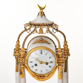 A Louis XVI mantel clock.