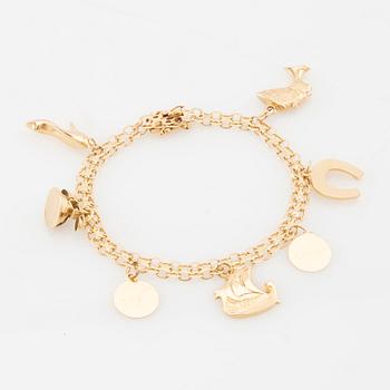 Bracelet 18K gold Bismarck link with charms.