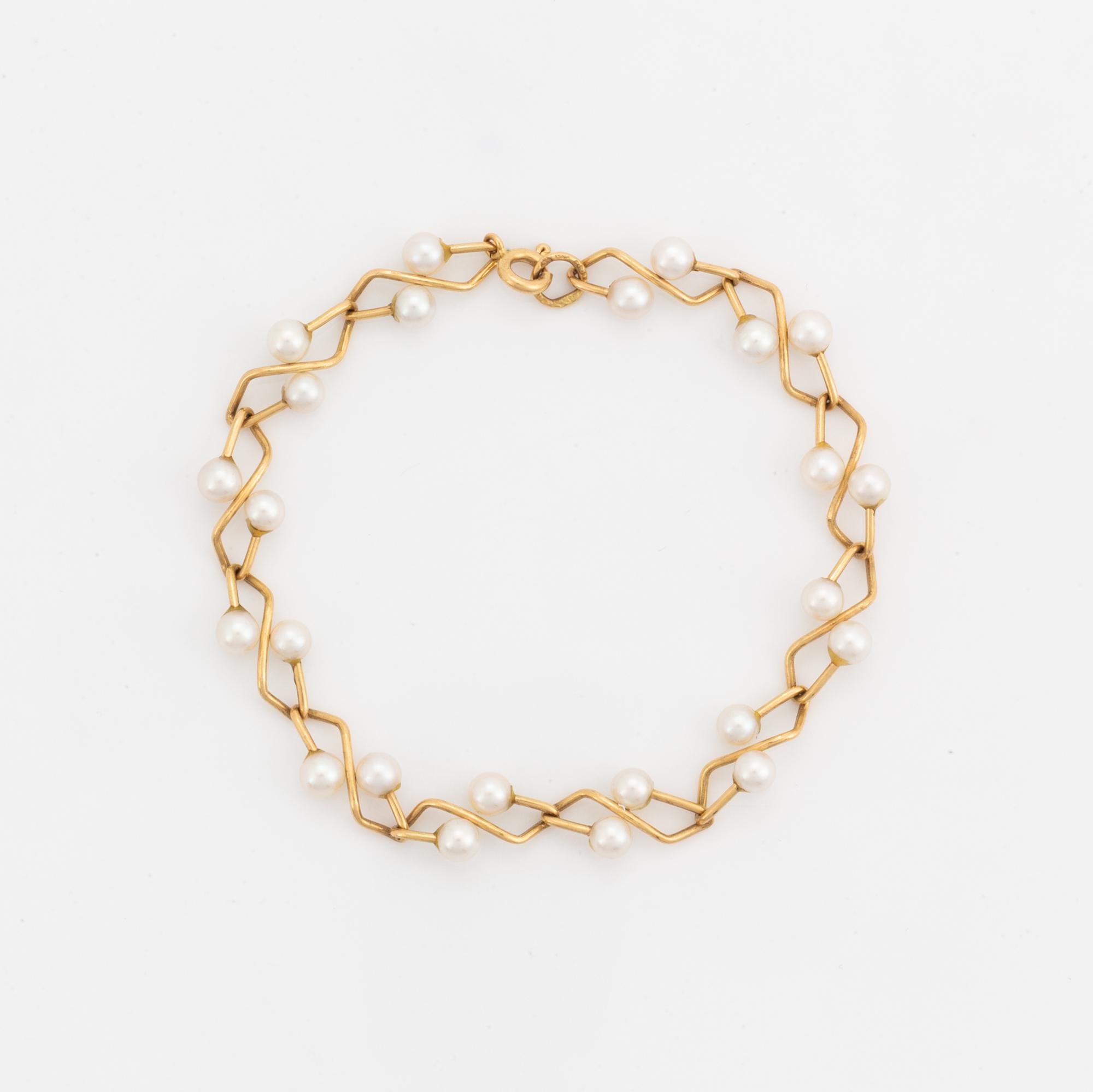 Armband, 18K guld med pärlor.