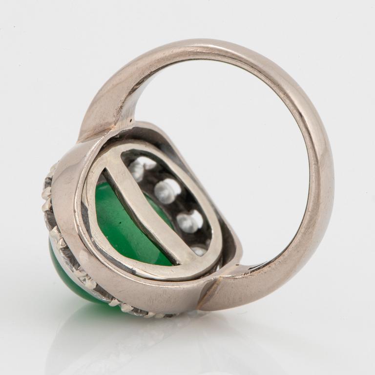 A jade and round brilliant-cut diamonds with a total weight of circa 0.60 ct.