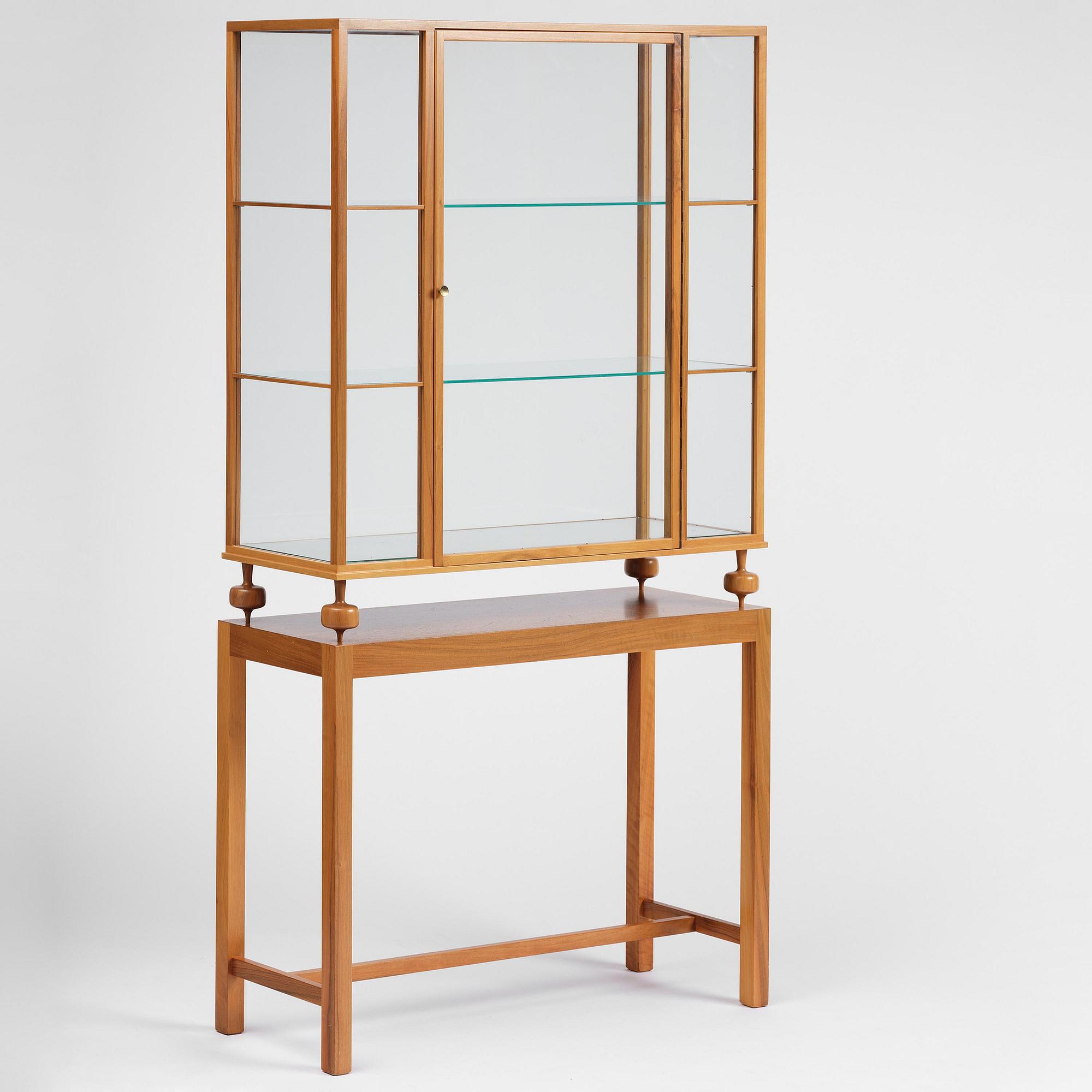 Josef Frank, a walnut showcase cabinet model "B 2077", Firma Svenskt Tenn.