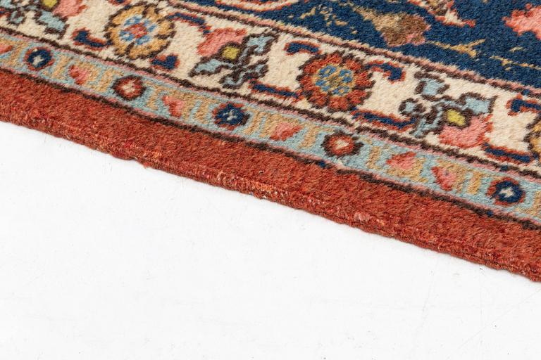An antique/semi antique Tabriz carpet, c. 325 x 229 cm.