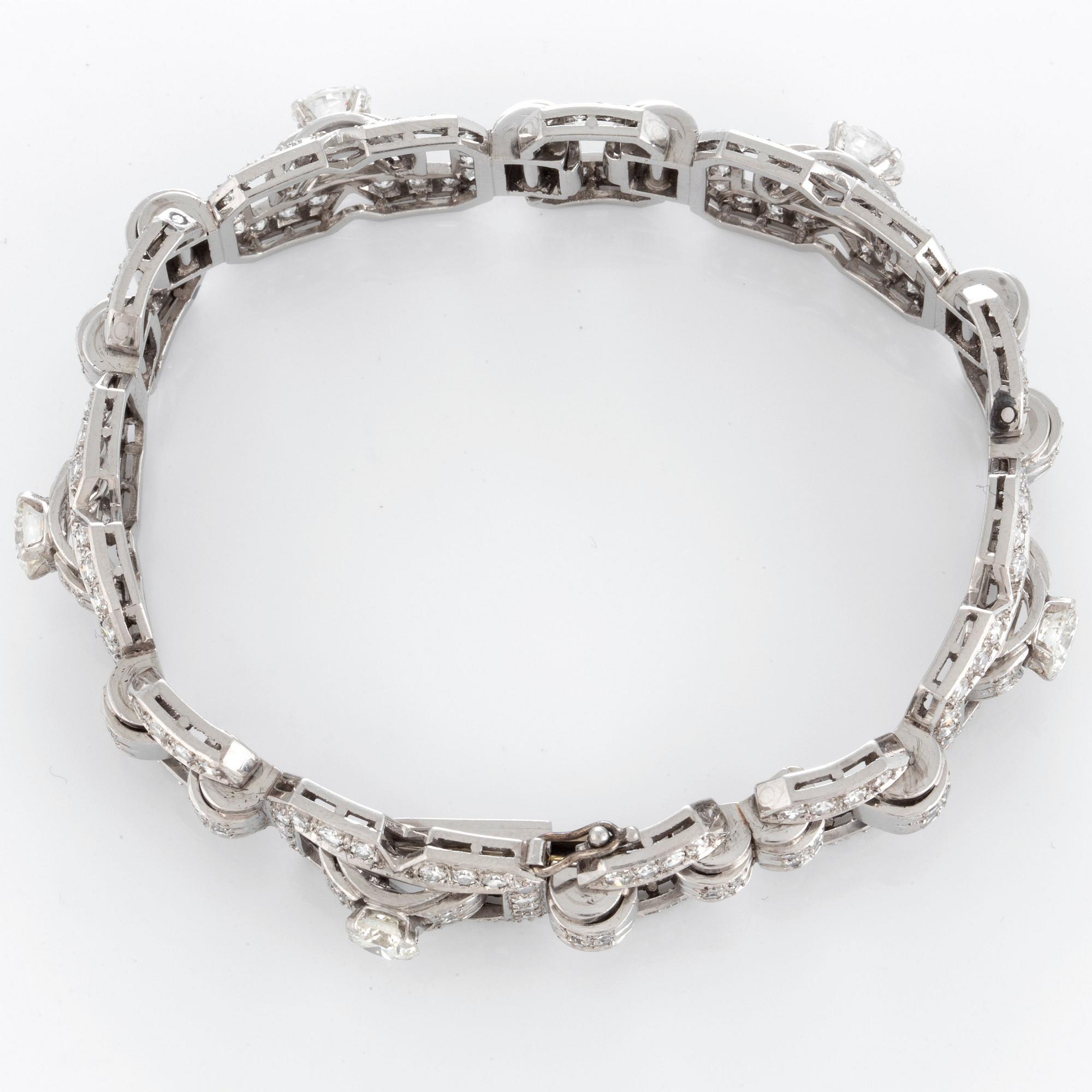 A platinum bracelet set with round brilliant- and eight-cut diamonds.