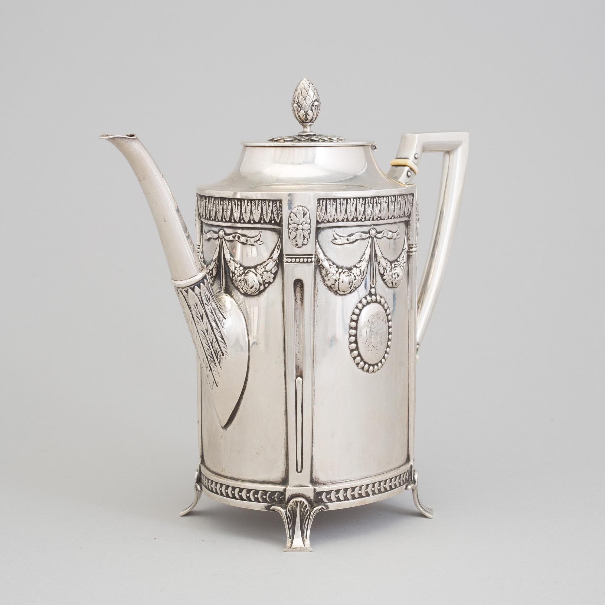 A set of three silver objects (coffeepot, creamer and sugarbowl, CG Hallberg and GAB, Stockholm 1907. Weight ca 1226 gr.