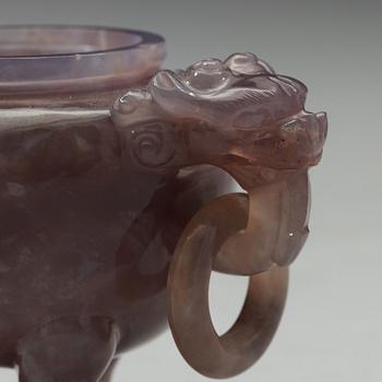 An amethyst tripod censer with cover, China, early 20th Century.