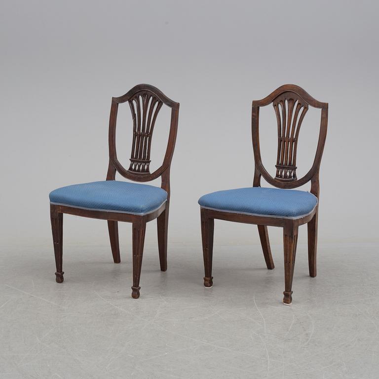 A 19th century dining table and a set of twelve chairs.