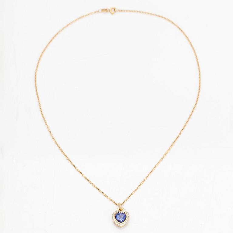 An 18K gold necklace, with a heart-shaped tanzanite and brilliant-cut diamonds.