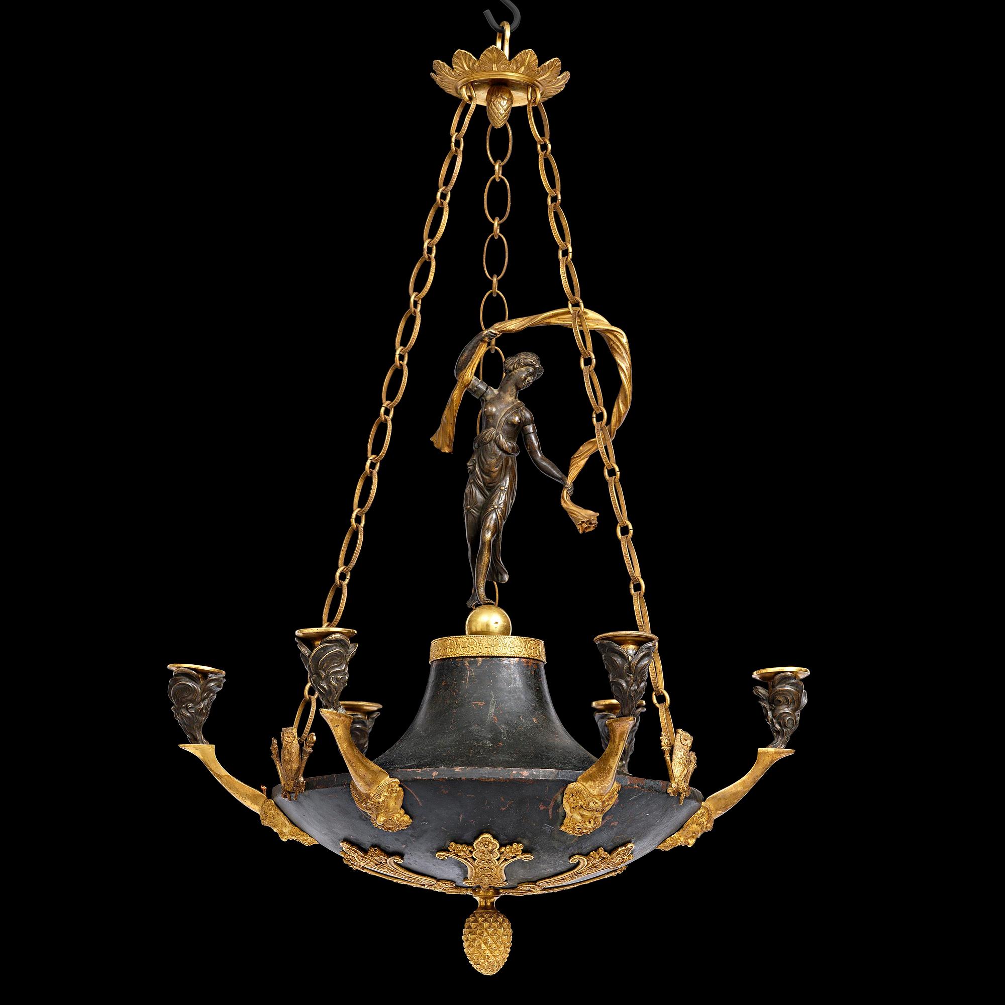 A patinated and ormolu six-light Empire chandelier, Stockholm, first part 19th century.