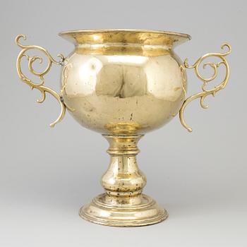 A 19th century brass champagne cooler.