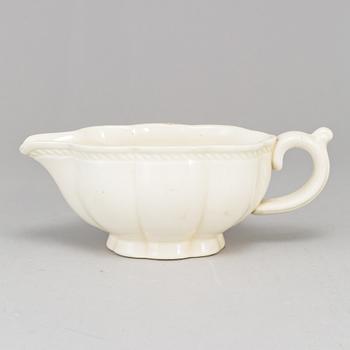 A Swedish Rörstrand creamware dish, end of 18th Century. And a white glazed creamer, probably 18th Century.