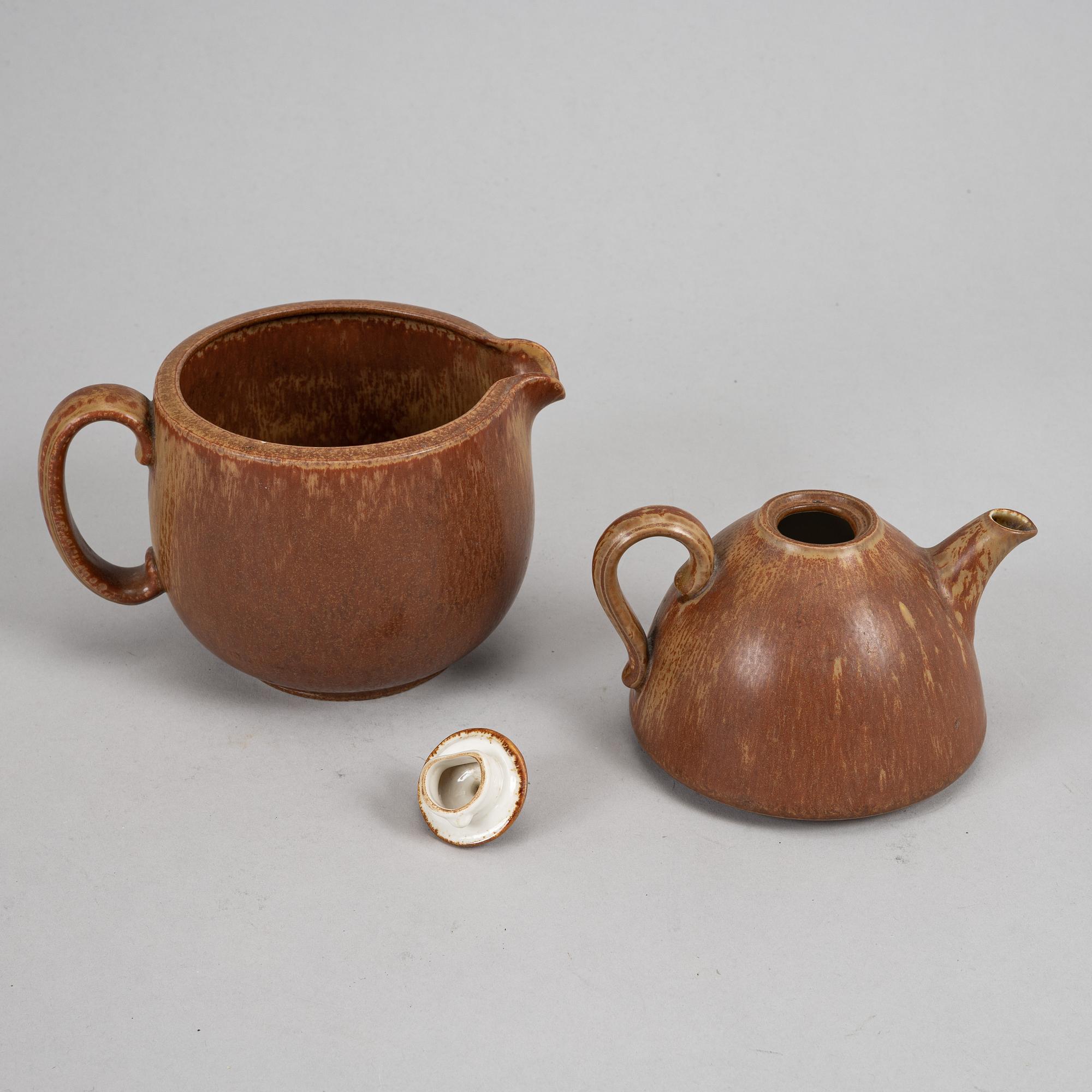 Tea pot, two bowls, two creamers, and a vase by Gunnar Nylund, stoneware, Rörstrand.