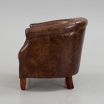 A leather club lounge chair by Newport, ca 2000.