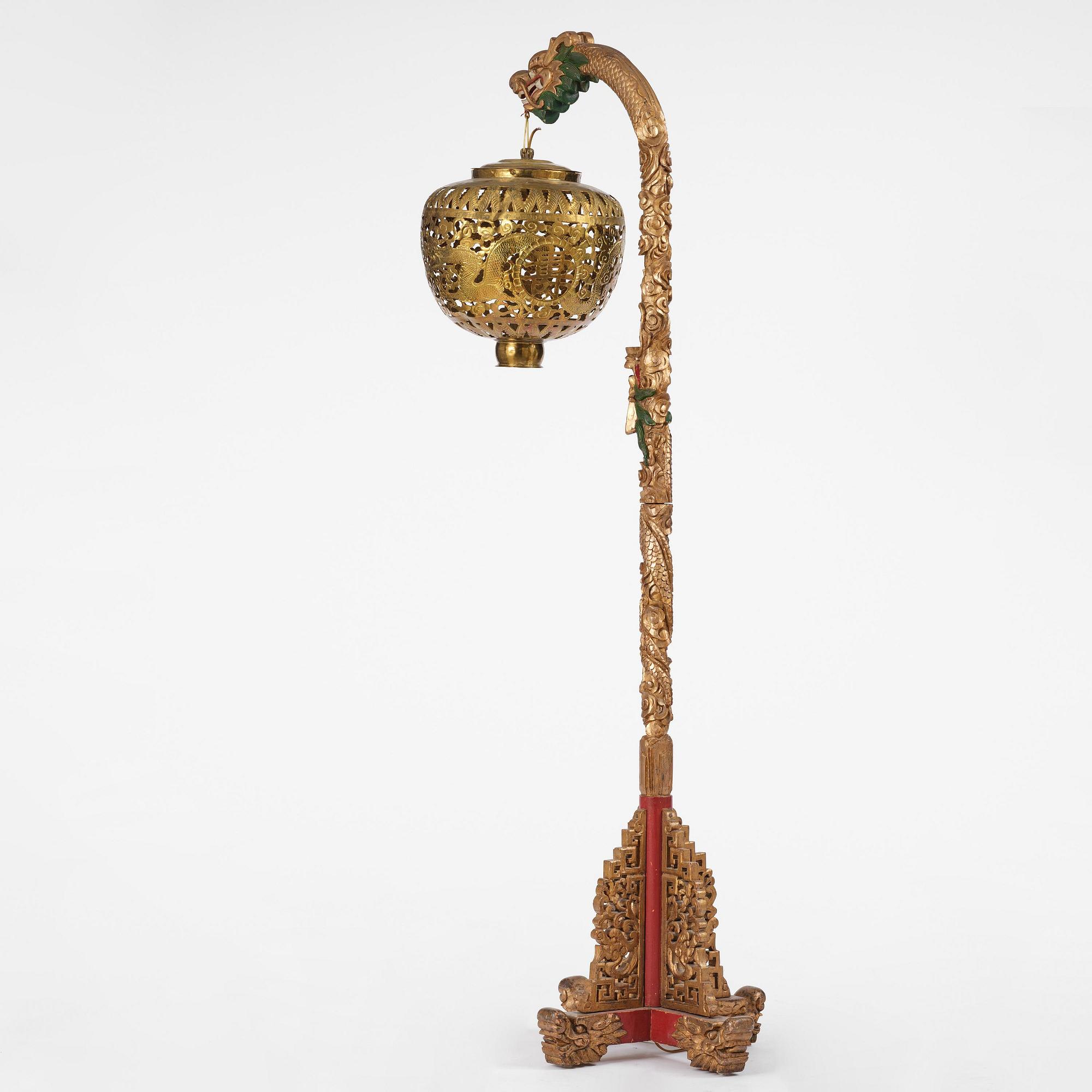 A Chinese gilt wood lantern with brass shade, Qing dynasty, 19th century.