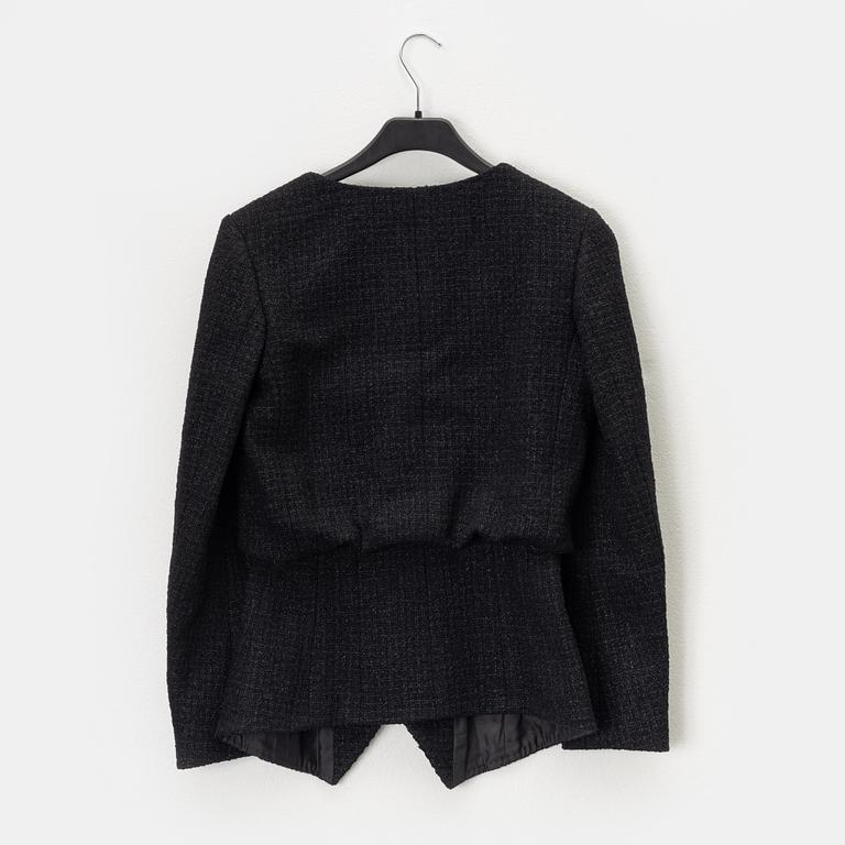 Chanel, A black bouclé jacket, size 34.