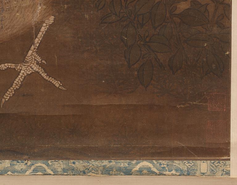 A hanging scroll of birds and magnolia in a garden, Qing dynasty.