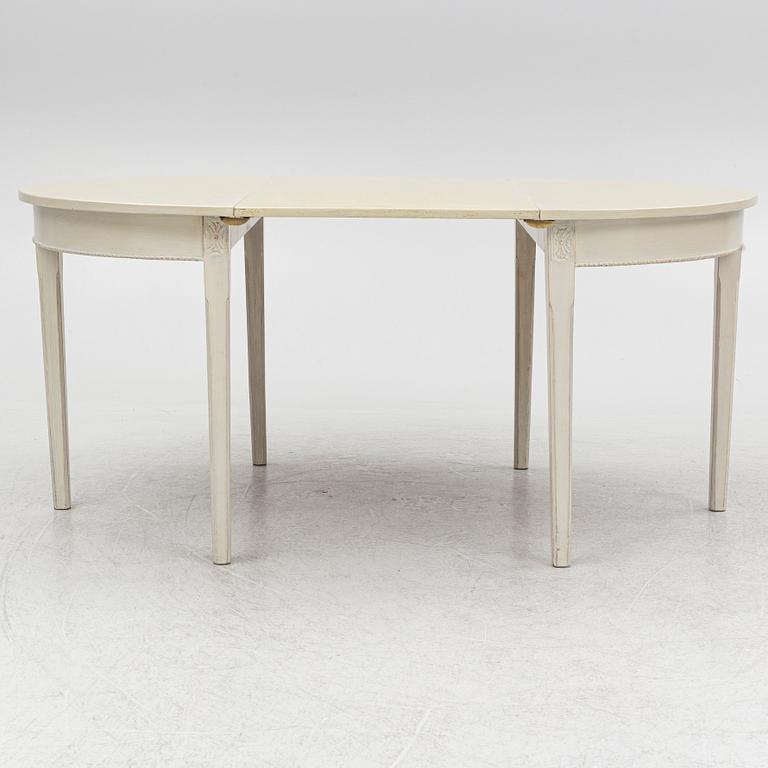 A Gustaivan style dining table/ two crescent shaped tables, end of the 19th century.