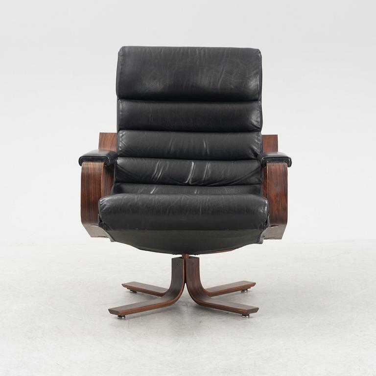 Karl-Erik Ekselius, a rosewood swivel armchair from JOC Vetlanda, 1980's.