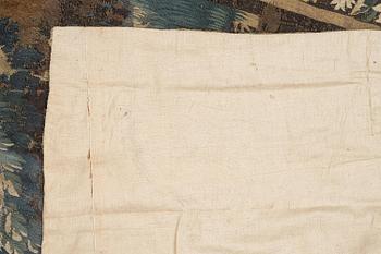 A 17th century Flemish 'verdur' entre-fenêtre tapestry, c. 268 x 130 cm.