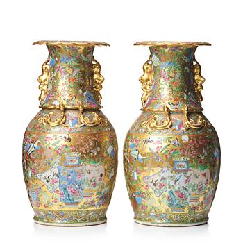 744. A pair of famille rose Canton vases, Qing dynasty, 19th Century.