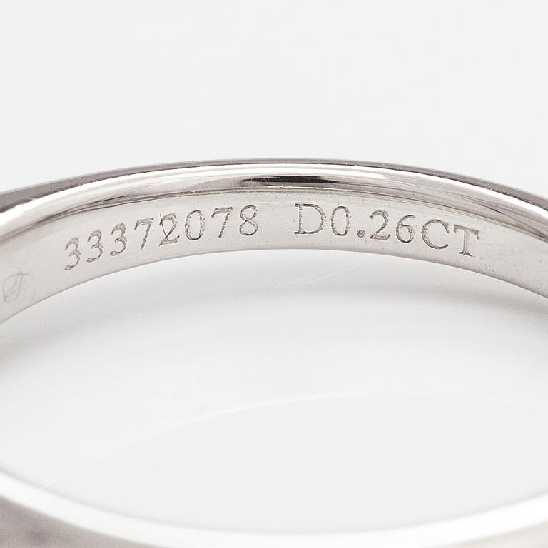 Tiffany & Co, A platinum ring with a ca. 0.26 ct diamond.