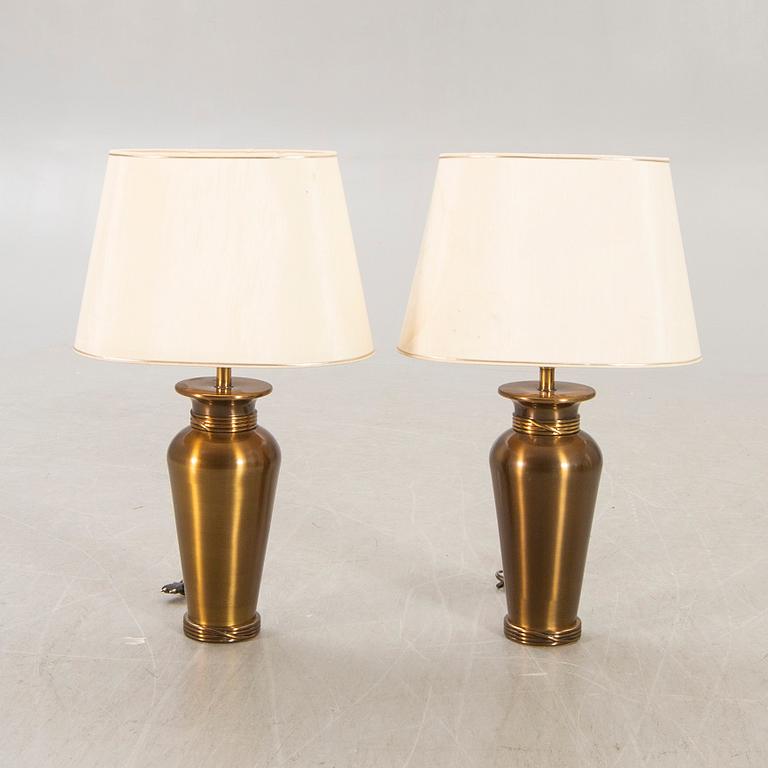 A pair of Deknut metall table lamps later part of the n20th century.