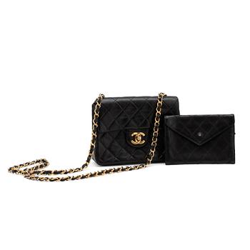 793. CHANEL, a black quilted leather "Mini flap" bag and wallet.