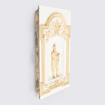 Reliefi / koriste-elementti kakluuniin Wilhelm Andstén, Helsinki, 1800-luvun loppu.