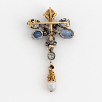 A brooch set with old-cut diamonds. fresh-water pearls and synthetic sapphires.