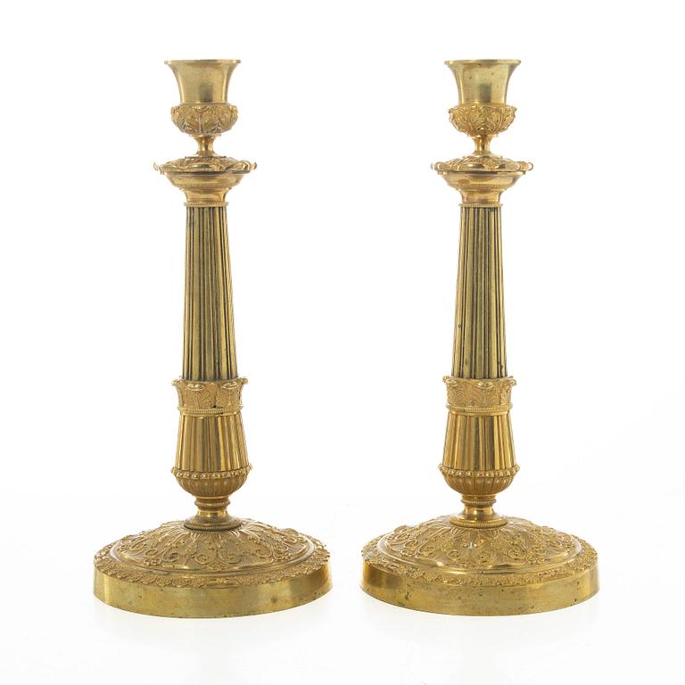 A pair of French Empire candlesticks, early 19th century.
