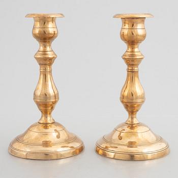 Skultuna Messinsbruk, two pairs of brass candlesticks, 19th century.