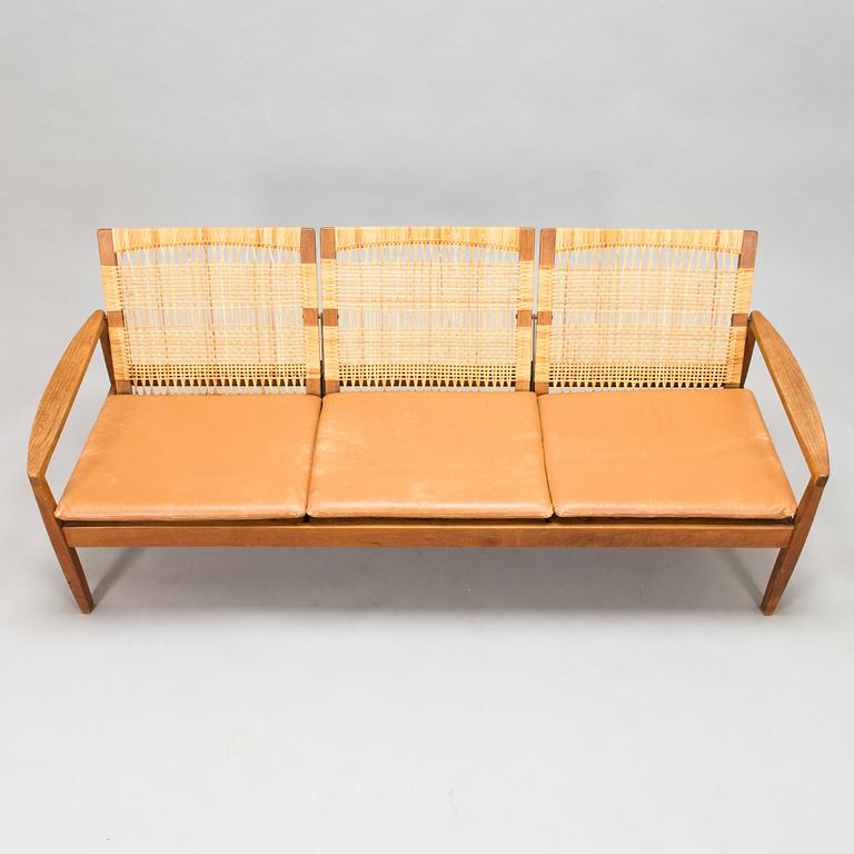 Hans Olsen, A teak and rattan sofa for Juul Kristensen, Denmark, late 1950s.