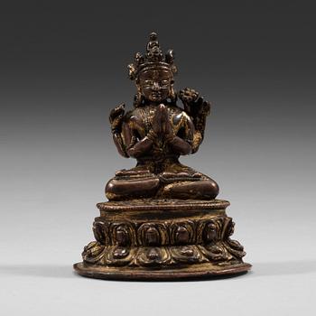 6. A Tibetan copper alloy figure of Bodhisattva Shadakshari Lokeshvara, with traces of gilding, 16th century.