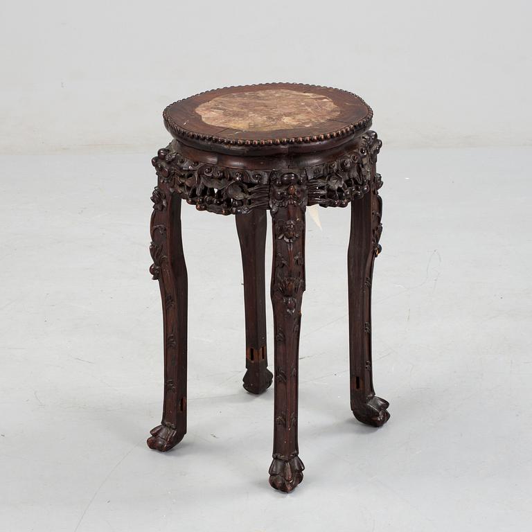 A hardwood table with marble top, China, 20th Century.