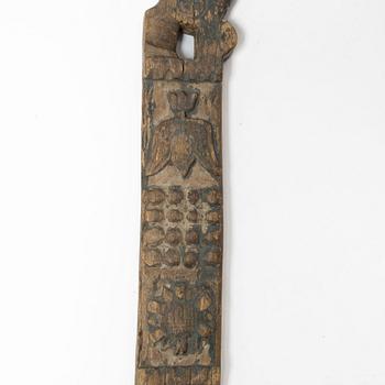 A Swedish carved and painted horse harness part, 18th century.