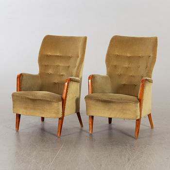 A pair of first half of the 20th century lounge chairs.