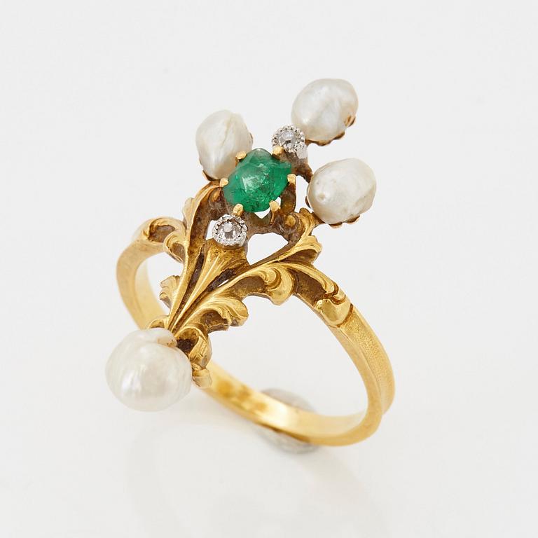 An 18K gold ring set with an emerald, pearls and old-cut diamonds.