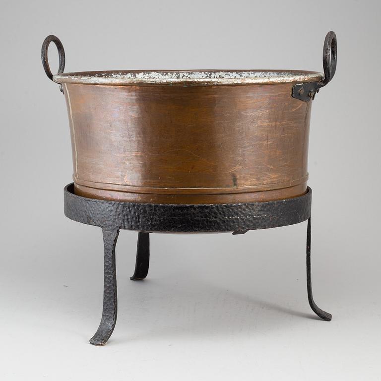A 19th century copper cauldron.