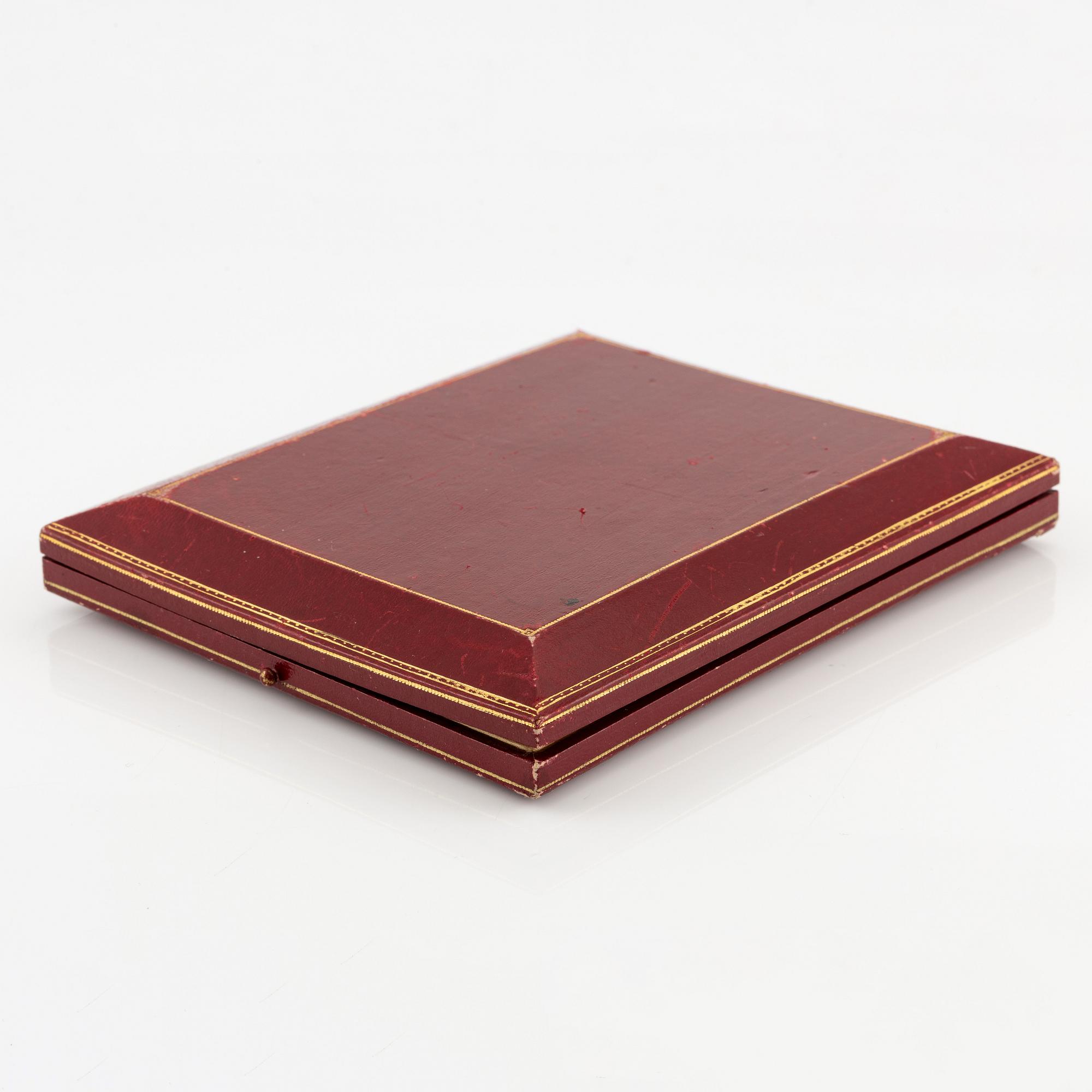 A necklace/tiara combination in 18K gold and green enamel set with old-cut diamonds.