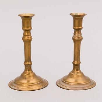 Set of ten 19th/20th Century brass and wood candlesticks.