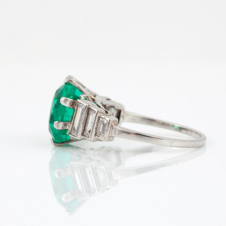 A cushion-shape mixed cut Colombian emerald, 4.56 cts, and baguette-cut diamond ring.
