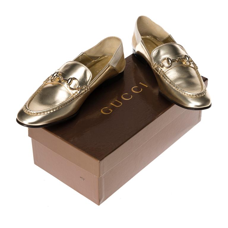 SKOR, Gucci.