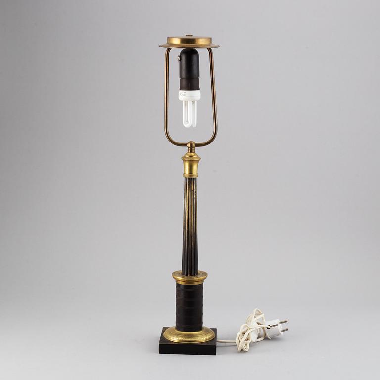 An empire style table lamp from the first half of the 20th century.