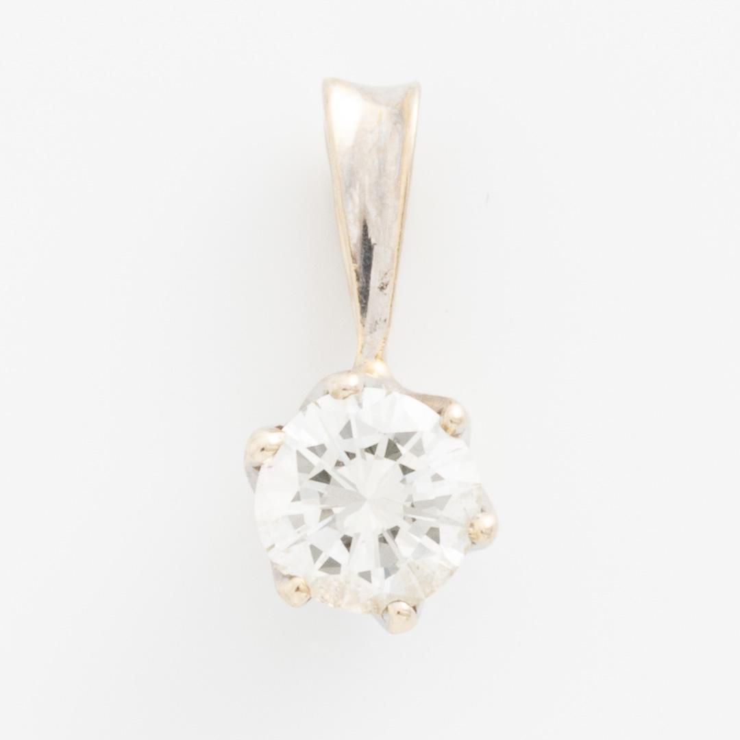Hänge 18K guld med en rund briljantslipad diamant.