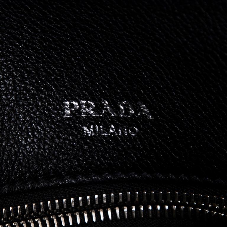 Prada, a leather bag.