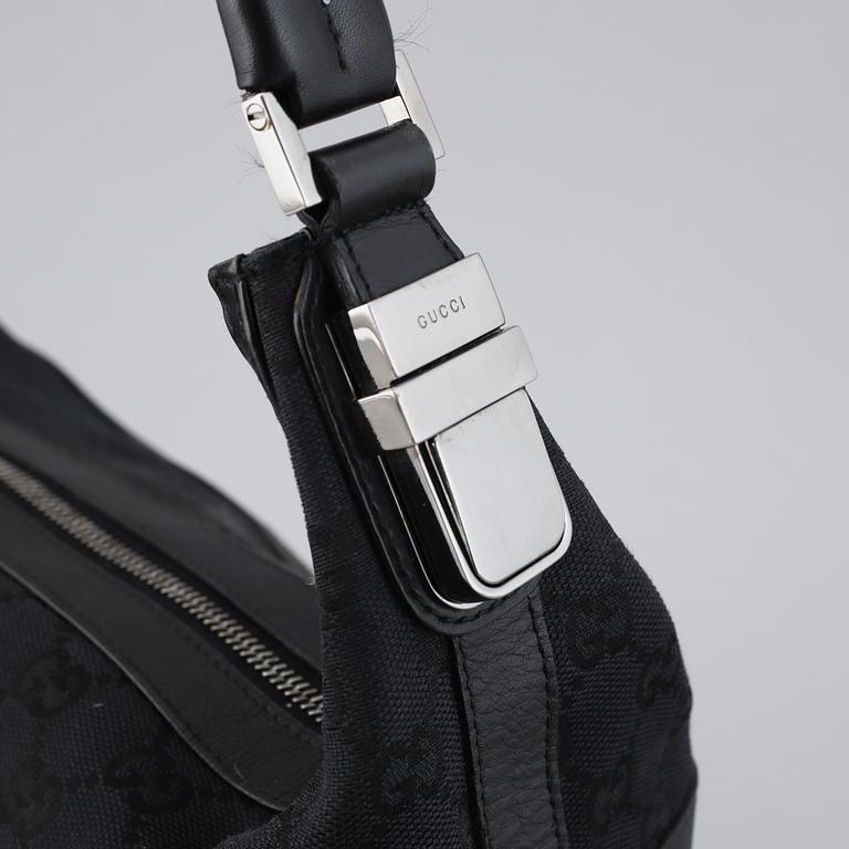 GUCCI, a canvas and leather bag.