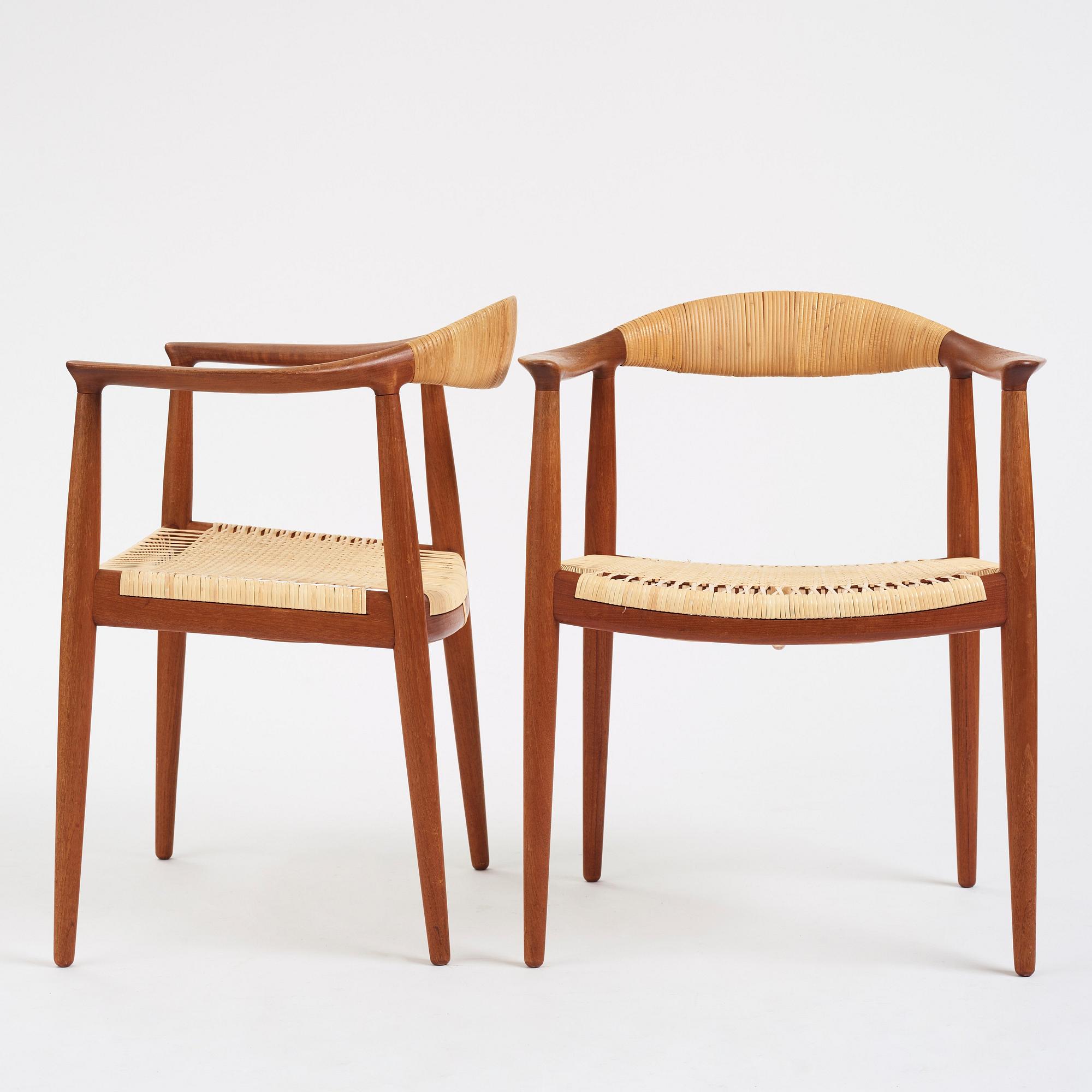 Hans J. Wegner, a pair of teak and rattan 'The Chair', JH-503, Johannes Hansen, Denmark 1950s.