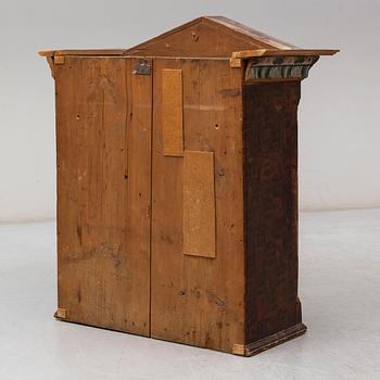 An 18th century folk art cabinet.