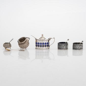 A silver mustard pot and spoon, salt cellars and salt spoons, totally 11 pieces, late 19th century - 20th century.